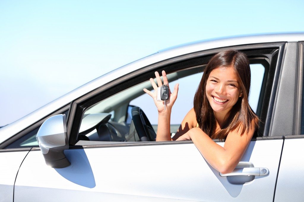 Woman smiling inside the car